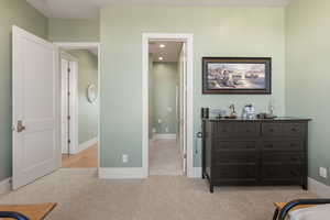Bedroom with light carpet and recessed lighting