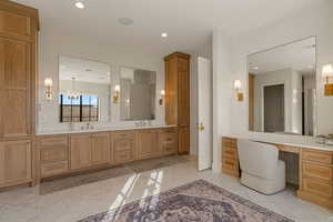 Bathroom with double vanity and recessed lighting