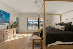 Bedroom with access to exterior, light wood-style flooring, ceiling fan, and recessed lighting