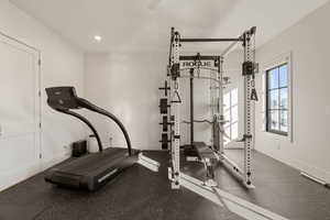 Workout room with baseboards and recessed lighting