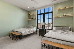 Bedroom with light carpet, a ceiling fan, and recessed lighting