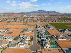 Aerial perspective of suburban area with a mountainous background