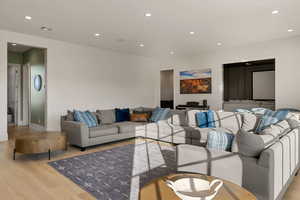 Living area featuring recessed lighting and light wood-style floors