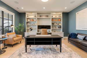 Office featuring light wood-style floors, recessed lighting, and built in features