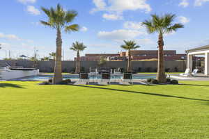 Fenced backyard with a patio