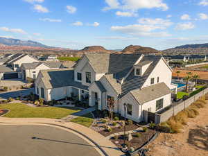 Aerial perspective of suburban area featuring a mountain backdrop