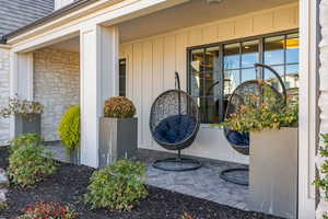 View of exterior entry with a porch