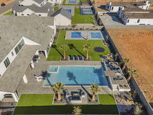 Aerial perspective of suburban area featuring a pool area