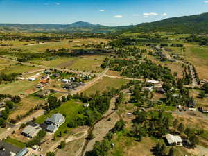 Aerial view of property's location featuring mountains and rural landscape