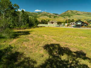 View of mountain backdrop with rural landscape