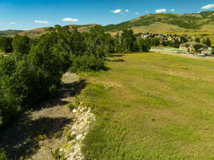 View of mountain backdrop with rural landscape