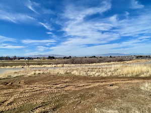 View of yard featuring a view of countryside and a mountain view