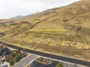 Aerial overview of property's location featuring a mountain backdrop and property boundaries highlighted