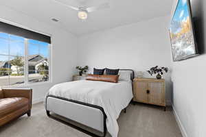 Bedroom with carpet flooring and ceiling fan