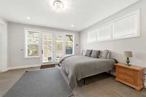 Carpeted bedroom with access to exterior and recessed lighting