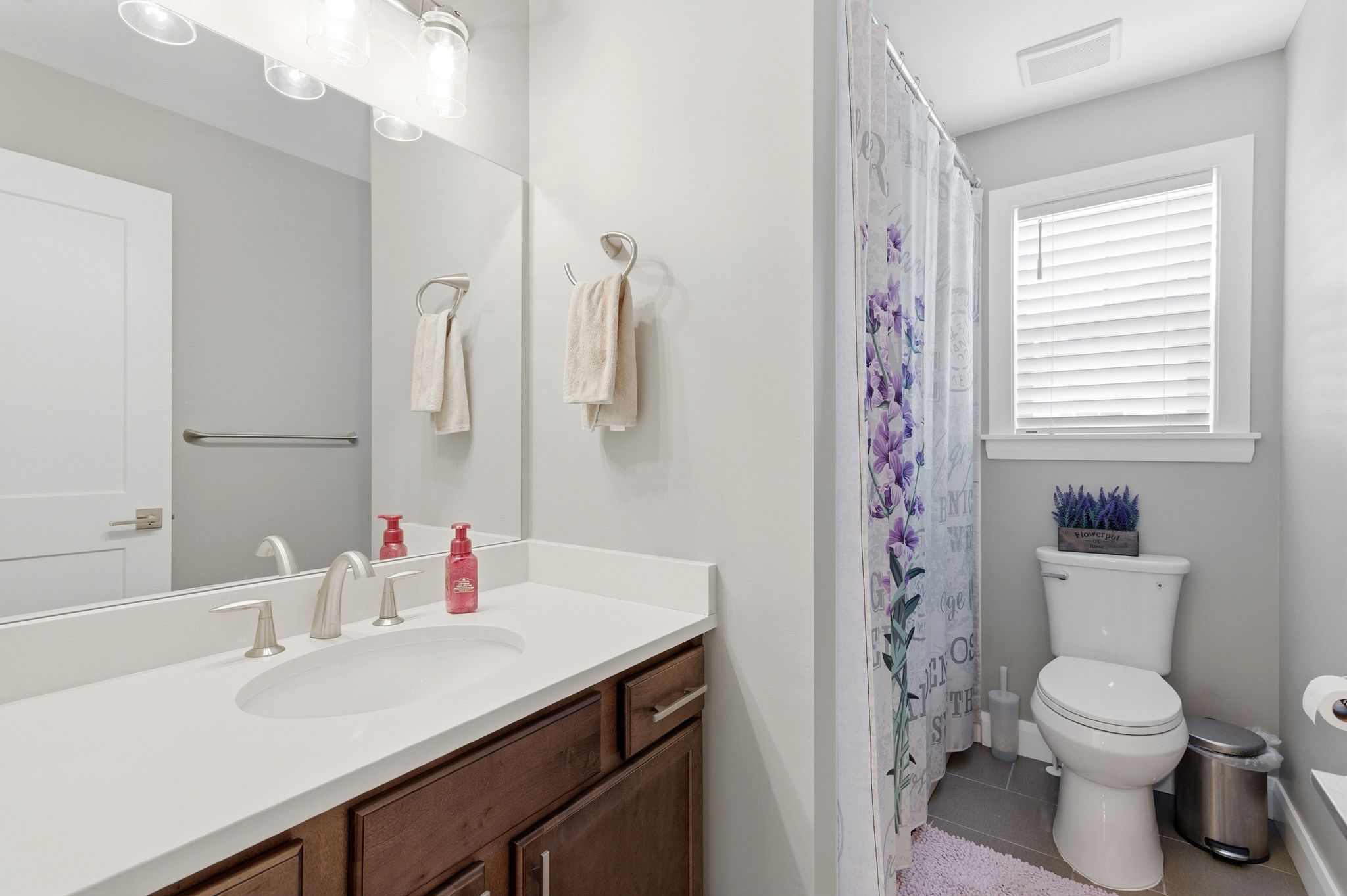 Bathroom with vanity, a shower with curtain, and tile patterned floors