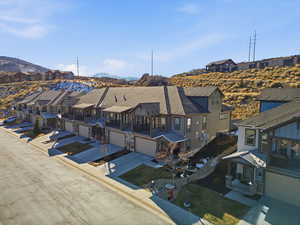 Aerial view of residential area featuring a mountain backdrop