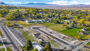 Aerial view of residential area featuring a mountainous background