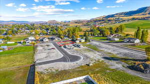 Aerial perspective of suburban area featuring mountains and property boundaries highlighted