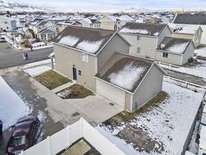 Snowy aerial view featuring a residential view