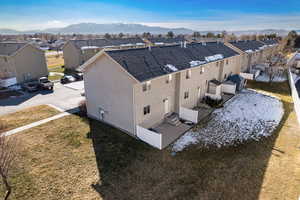 Aerial perspective of suburban area with a mountainous background