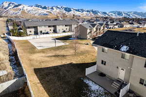 Aerial perspective of suburban area with a mountain backdrop