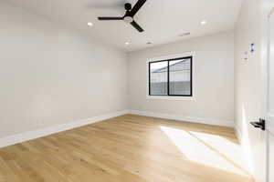 Unfurnished room with light wood finished floors, recessed lighting, and a ceiling fan
