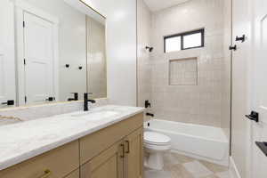 Bathroom featuring vanity and bathing tub / shower combination