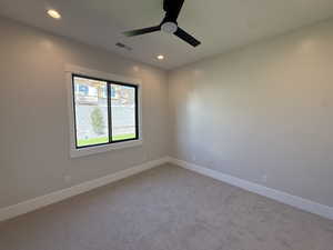 Unfurnished room with carpet flooring, ceiling fan, and recessed lighting