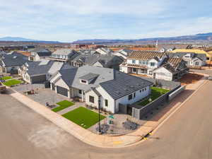 Aerial perspective of suburban area featuring a mountainous background