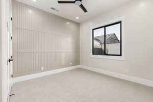Spare room with light carpet, a ceiling fan, and recessed lighting