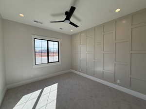 Unfurnished bedroom with carpet floors and a ceiling fan