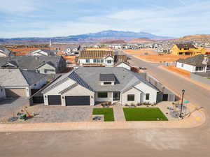 Aerial view of residential area with a mountainous background