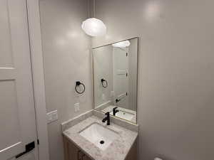 Half bath with vanity and toilet