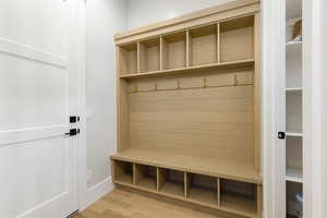 Mudroom with light wood-style flooring