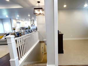 Stairway with recessed lighting and carpet