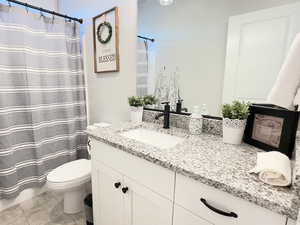Bathroom featuring vanity and a shower with curtain