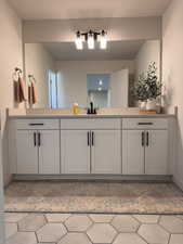 Bathroom with vanity and light tile patterned floors