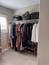 Walk in closet featuring light tile patterned floors