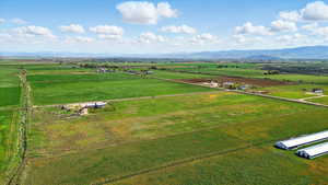Aerial view of sparsely populated area with a mountainous background