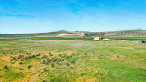 View of mountain backdrop featuring rural landscape