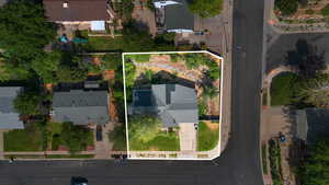 Aerial view of residential area featuring property boundaries highlighted