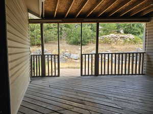 Wooden deck with a sunroom