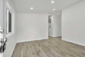 Empty room featuring recessed lighting and light wood-style floors