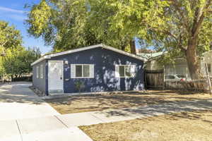 View of front of property featuring concrete driveway