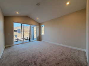 Empty room featuring light colored carpet and recessed lighting