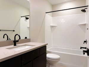 Full bathroom featuring vanity and washtub / shower combination