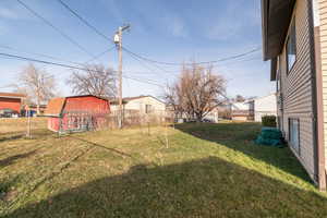 View of yard with an outdoor structure