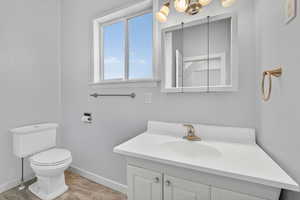 Bathroom view showing fixtures and storage.