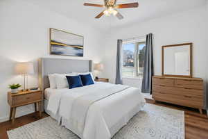 Virtually staged main level bedroom with natural light.